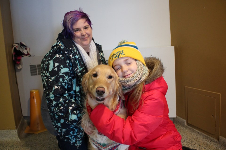 Jessica and Sophie Heywood, with Abby the dog, at the Coldest Night of the Year fundraiser in Sudbury on Feb. 25.