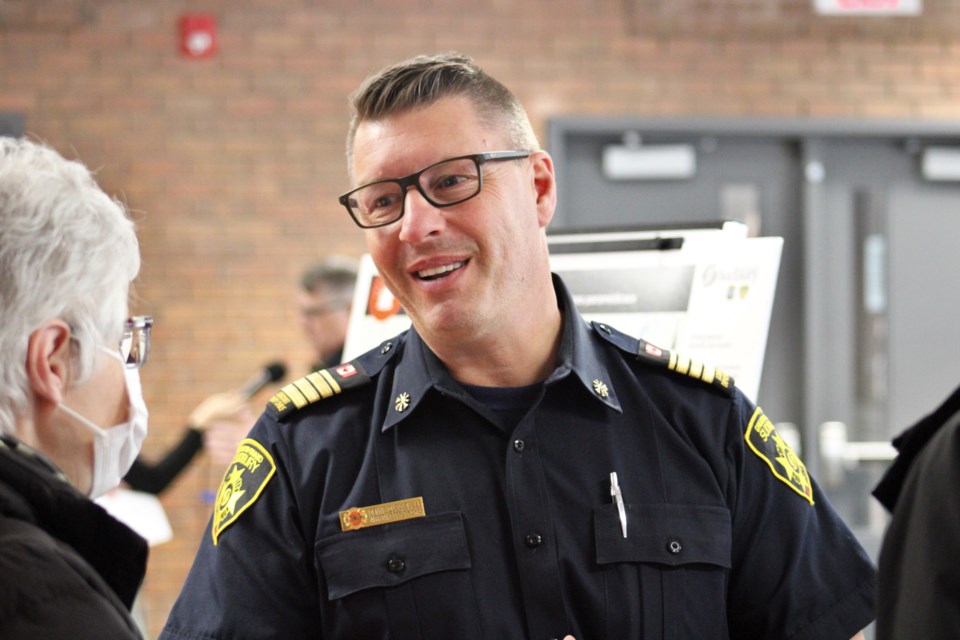 Greater Sudbury Fire Services assistant Deputy Chief Dennis Quenneville speaks to a resident during Tuesday night’s emergency services station relocation review public meeting at St. Charles College. It was the first in a series of meetings throughout Greater Sudbury slated to take place between now and May 17.