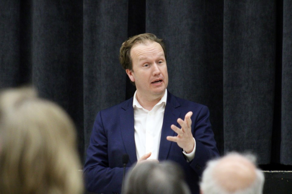 Mayor Paul Lefebvre speaks during Wednesday’s town hall-style meeting at École secondaire Macdonald-Cartier.