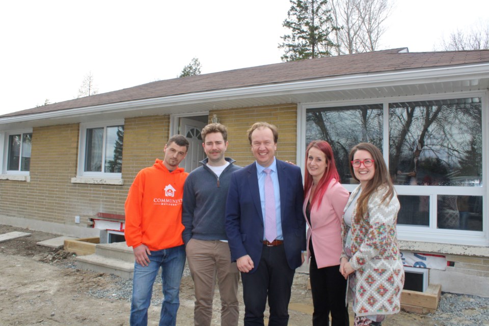 Community Builders employee Josh Stone, Raising the Roof director of housing development Adrien Dingle, Mayor Paul Lefebvre, Sudbury Centre for Transitional Care executive director Jehnna Morin and Community Builders managing director Carly Gasparini are seen during the grand opening of an affordable housing building at 1517 Kingslea Ct. in New Sudbury on Wednesday.