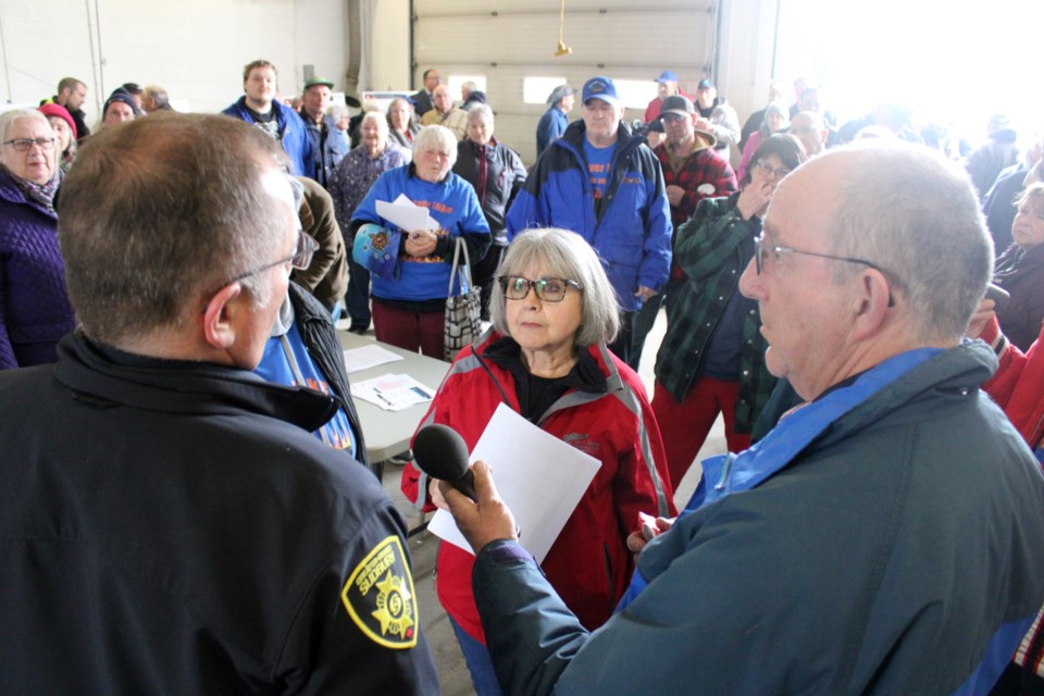 Beaver Lake resident Linda Heron listens to a response to her question to Greater Sudbury Fire Services interim deputy chief Craig Lawrence during Wednesday’s public consultation meeting at the Beaver Lake fire station. 