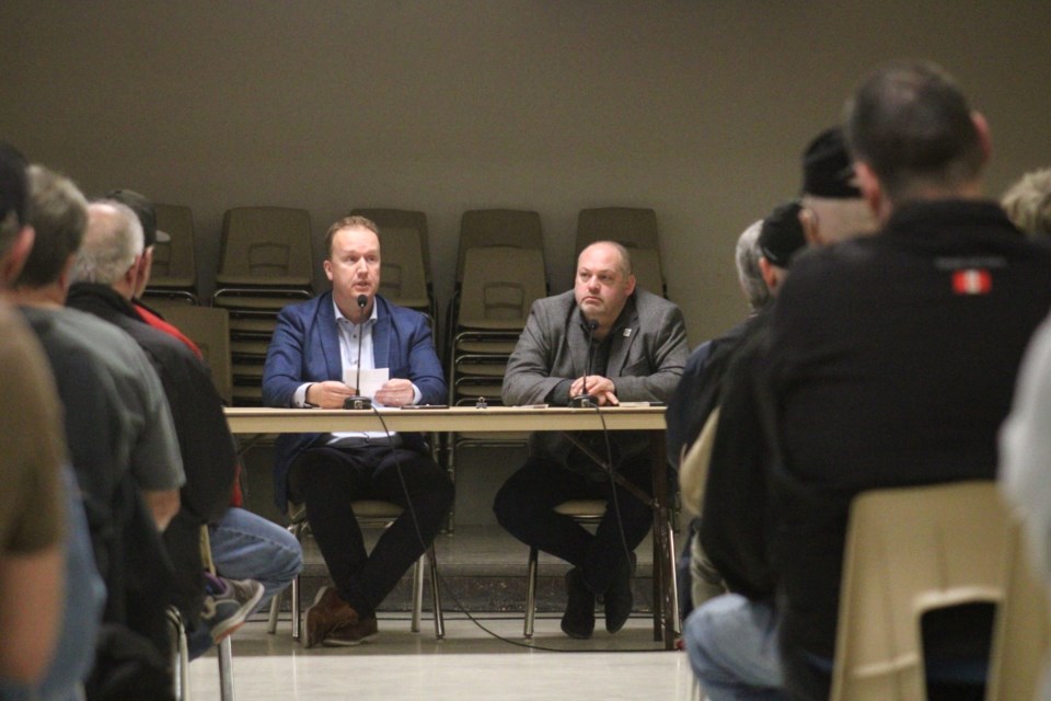 Mayor Paul Lefebvre and Ward 6 Coun. René Lapierre are seen heading Wednesday night’s town hall meeting at Centennial Community Centre and Arena in Hanmer.
