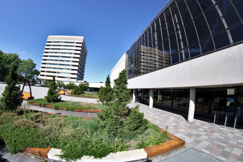 Tom Davies Square, right, is seen from its back courtyard in close proximity to 199 Larch Street, pictured at left, in this photograph taken using a fisheye lens. The city has proposed shifting the majority of municipal services from Tom Davies Square to vacant space at 199 Larch Street, and filling Tom Davies Square with the Junction East Cultural Hub library/art gallery project.