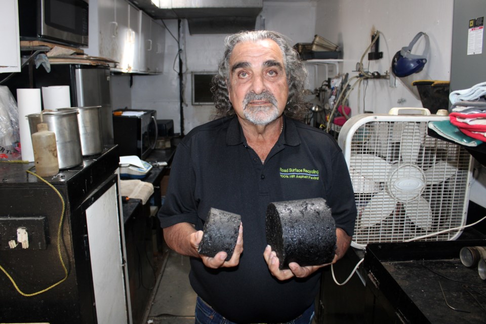 Frank Crupi, vice-president of technology and research at Road Surface Recycling, is seen in his company’s mobile testing station, with asphalt samples he said passed, overall. 