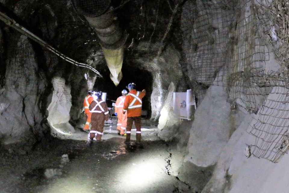 Miners walking through a drift in part of the NORCAT Underground Centre in Levack.