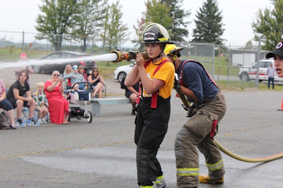 Participants at Camp Molly showed off the firefighting skills they'd gained at a competition in front of family members on Aug. 20.