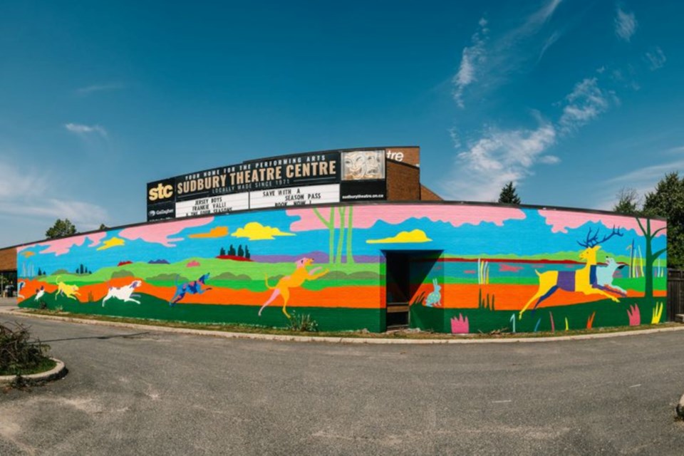 Jean Paul Langlois' mural, "A Young Prince Hounded by Ignoble Beasts Pressed into Man's Servitude Or My Dogs in the Road," is seen at the side of the Sudbury Theatre Centre building. 