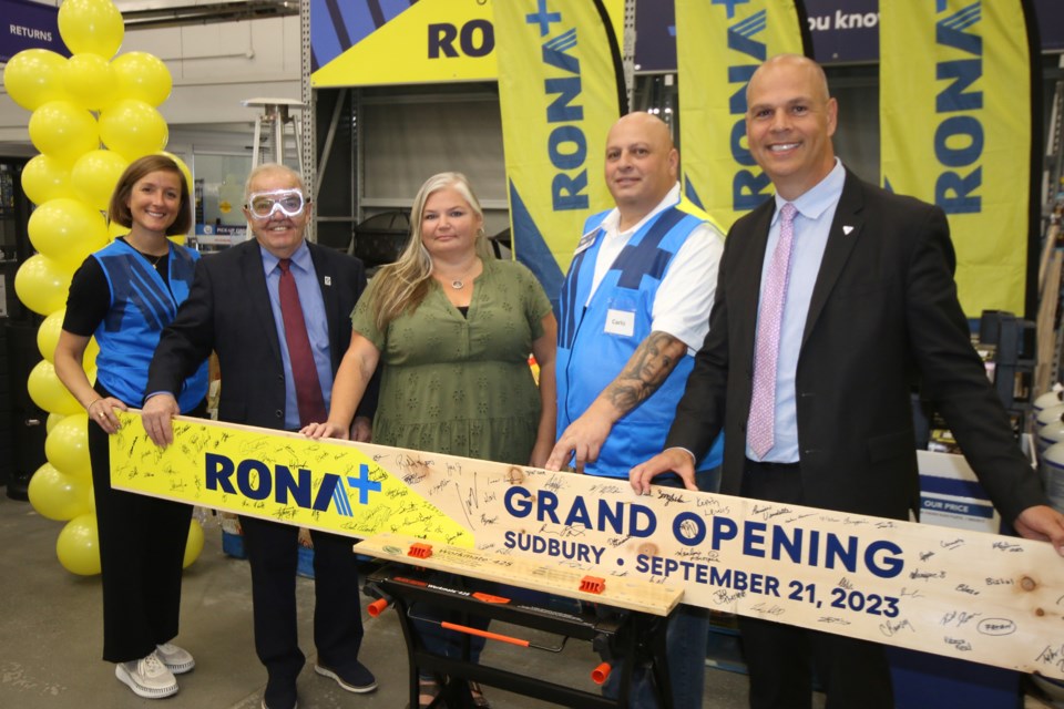 A board-cutting event was held at Rona+ to mark the new chapter in that store's history. Taking part, from left to right, were Rona marketing executive Catherine Laporte, Sudbury deputy mayor Al Sizer, Monarch Recovery Service program supervisor Angie Gaudette, Rona+ store manager Carlo Persampieri and Sudbury MPP Jamie West.