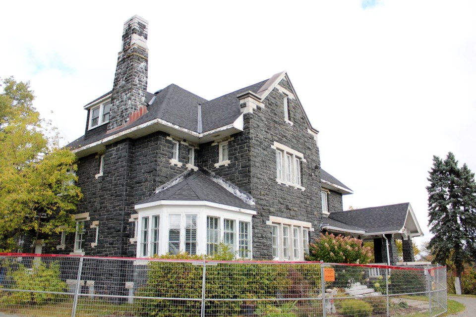 The historic Bell Mansion building, which houses the Art Gallery of Sudbury, is seen partially fenced off Oct. 13, 2023. The art gallery has been forced to temporarily close due to safety issues within the building.