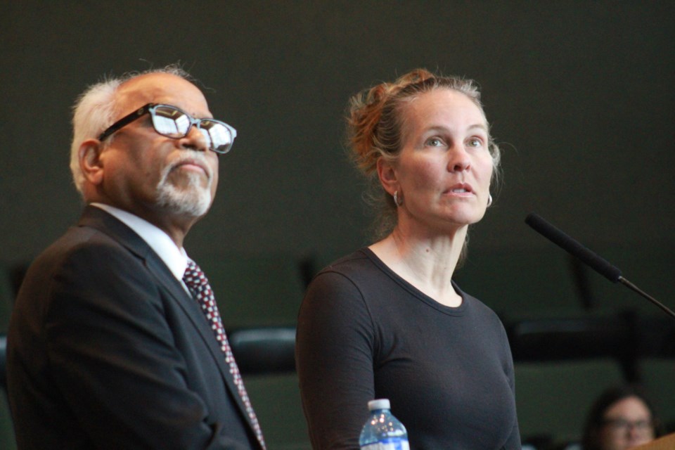 Health Sciences North Addictions Services medical lead Dr. Tara Leary and Mental Health and Addictions Programs medical director Dr. Rayuda Koka look up at a slide while presenting during Wednesday’s police board meeting.