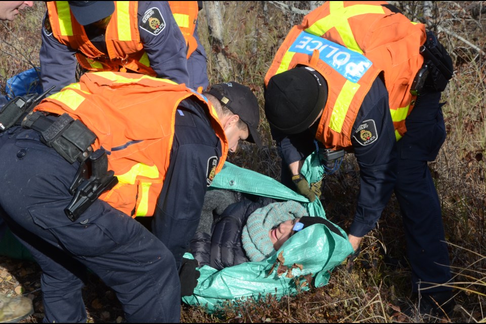 Greater Sudbury Police Service Search and Rescue Team conducting their annual training scenario on Oct. 28 in partnering with the Alzheimer Society Sudbury-Manitoulin North Bay & Districts. Officers search for and rescued a person portraying a dementia patient. Photo by Arron Pickard. 