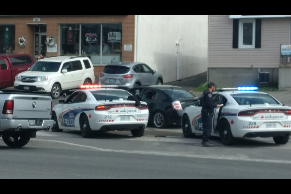 A high-stakes traffic stop on the Kingsway May 24 recovered a stolen black sedan. The 21-year-old male driver faces charges while a 30-year-old female passenger was taken into custody on an outstanding warrant. (Mark Gentili/Sudbury.com)