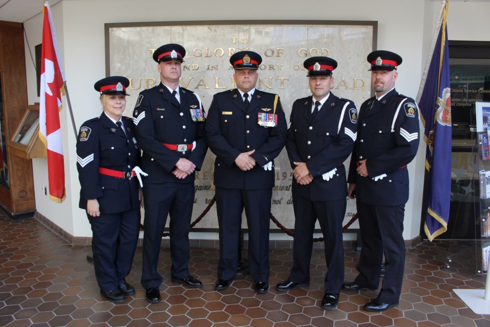 (L to R) Newly promoted GSPS officers Sgt. Angela Sirkka, Staff Sgt. Daryl Adams, Insp. John Valtonen, Sgt. Chris Brown, Sgt. Darin Heffern. Not pictured: Staff Sgt. Sara Cunningham. (Photo: Matt Durnan)