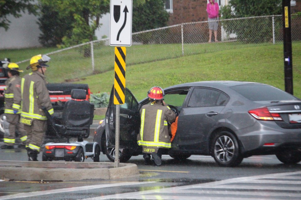 Northbound traffic on Notre Dame is slow going as Greater Sudbury Police and EMS workers are at the scene of a collision involving a motor vehicle and a man in a wheel chair. (Photo: Matt Durnan)