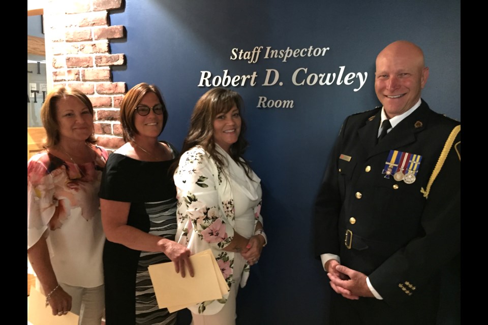 Greater Sudbury Police Service has named the Sudbury Region Police Museum in honour of Staff Insp. Robert D. Cowley on June 26. Pictured left to right: Staff Insp. Cowley's daughters Jennifer Weber, Susan Cowley-Stiller, Heather Cowley and GSPS police chief Paul Pedersen. (Heather Green-Oliver/Sudbury.com)