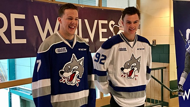 Sudbury Wolves players Reagan O'Grady(blue) and Blake Murray (white) show off the team's new jerseys. (Photo: Nick Liard)