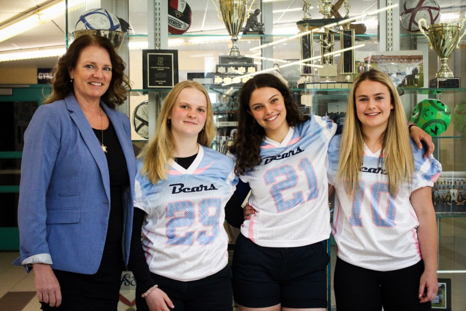 Laura Kuzenko (left), Hayley Deschenes, Jasmine Howell and Amelia Bois (right) had a sense they were about to participate in a game that would make history. 