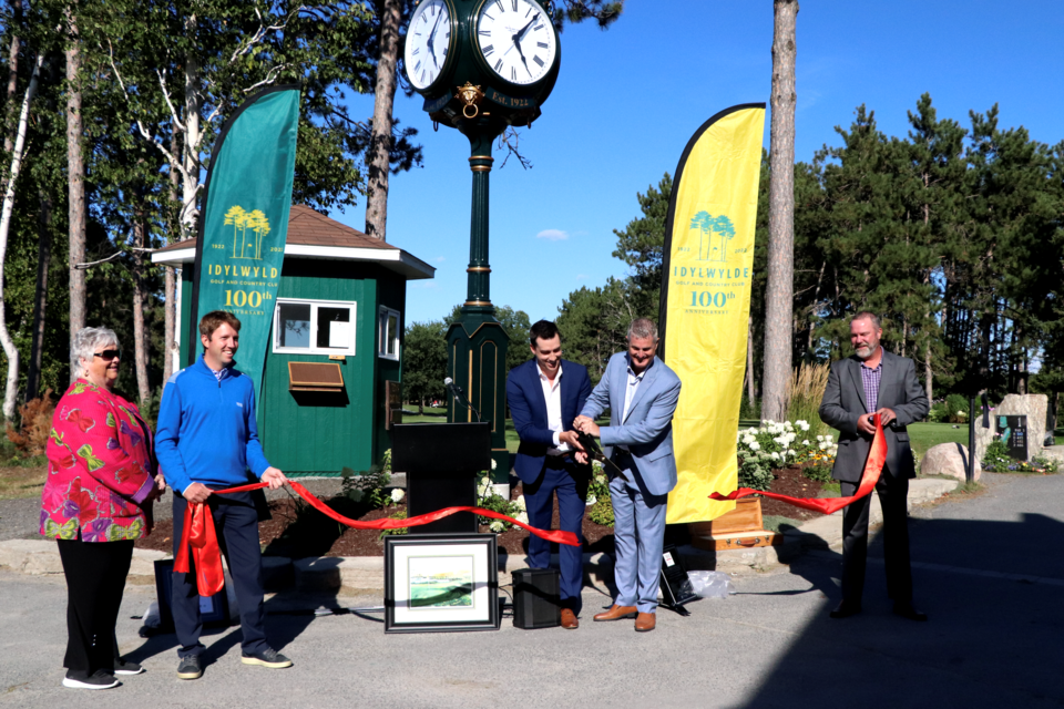 Established in 1922, the Idylwylde Golf & Country Club celebrated its 100th anniversary last Friday. From left, cutting the ribbon on a commemorative clock installed for the occasion, are Centennial Committee member Barbara Nott, head professional David Bower, club president Mike Andrighetti, Centennial Committee member Robbie Coe and club general manager Tom Arnott.