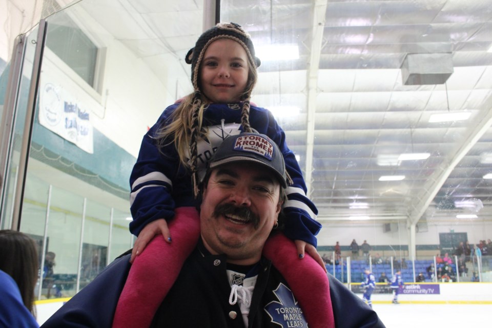 Jason McCourt gives Audrey McCourt, 4, a view at the Nickel Centre Minor Hockey Association Coaches vs. Leafs’ Alumni fundraising game at the Garson Arena Jan. 21.