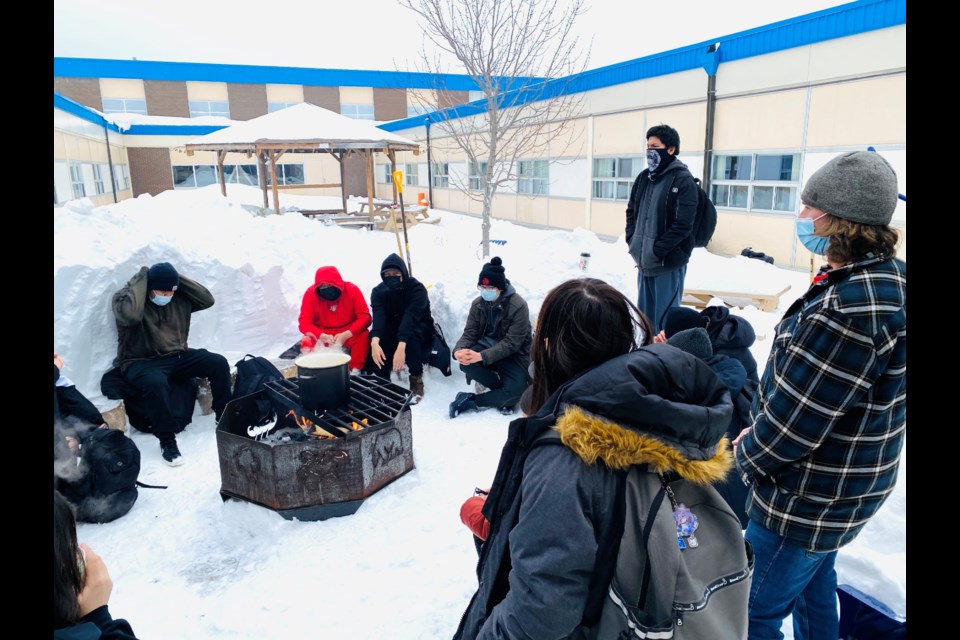 Students in the KZ Lodge program gather in a courtyard at Hammarskjold High School that includes a fire pit and teaching lodge. (Photos courtesy Lakehead Public Schools)