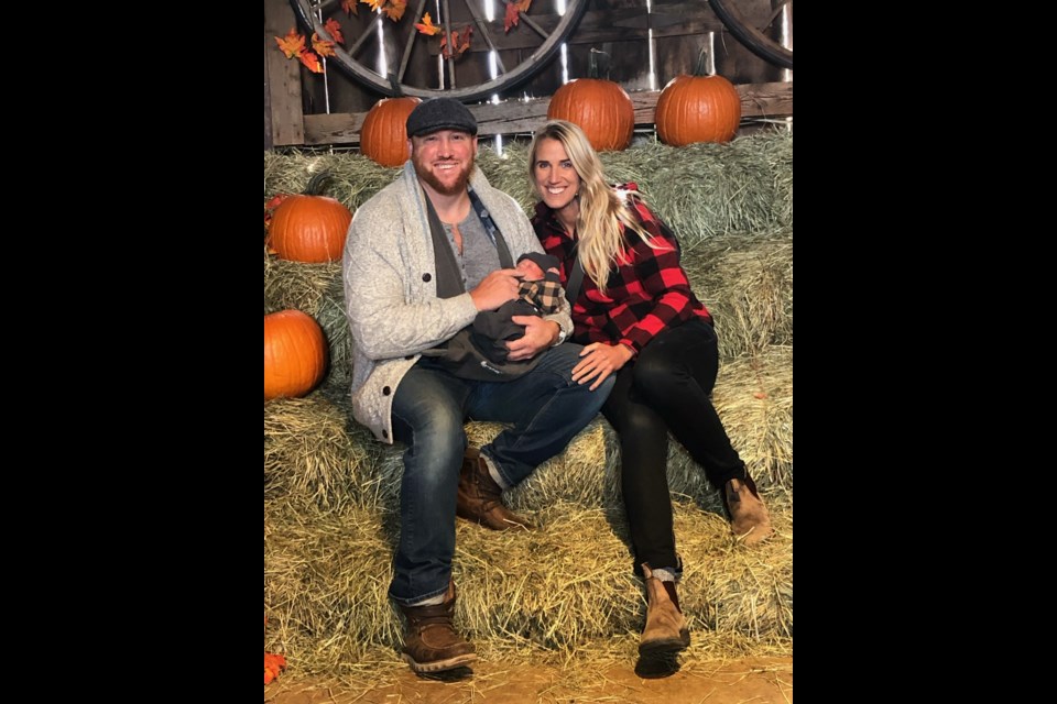 Steve LeCuyer and Kyla Rutherford with their newborn son Emerson, enjoying his first Fall season.
