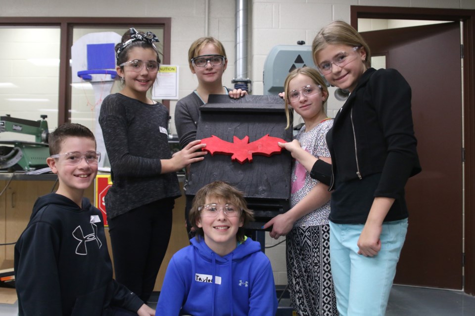 From left to right: Michael Ariganello, Paige Broughton, Mary-Catherine Fraser, Becca Storey, Megan Chambers, and Taylor Craigie-Yurick from Five Mile School hold up a completed bat box at Superior Collegiate and Vocational Institute. (Photos by Doug Diaczuk - tbnewswatch.om). 