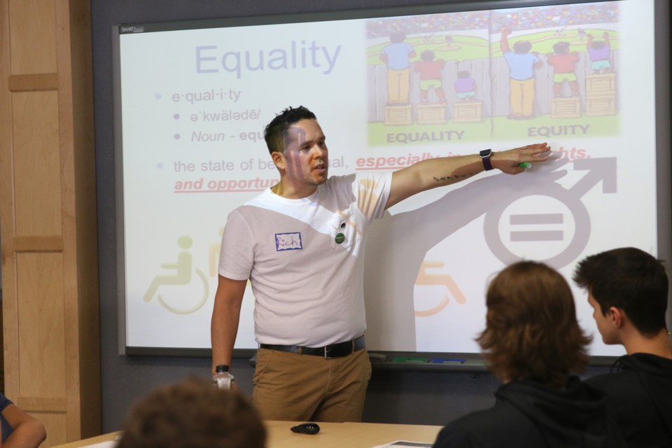 Richard Tatebe, professor coordinator at Confederation College’s Social Service Worker Program, teaches boys between grade 7 and 10 about equity and equality during a workshop on gender equality on Monday. 