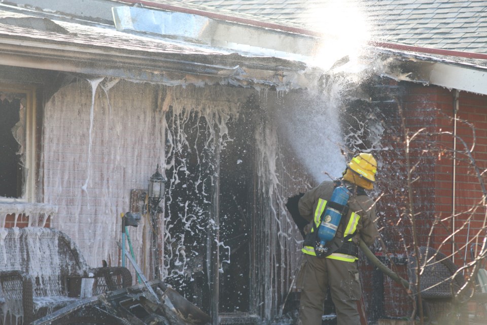Crews work to put our a fire at Bertrand Court on North Court Street Wednesday afternoon. The fire caused extensive damage to a single unit apartment. (Photos by Doug Diaczuk - tbnewswatch.com). 