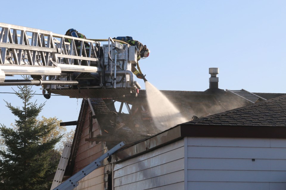 Fire crews with Thunder Bay Fire Rescue work to extinguish a fire on a north side home early Sunday morning. (Photos by Doug Diaczuk - tbnewswatch.com).  