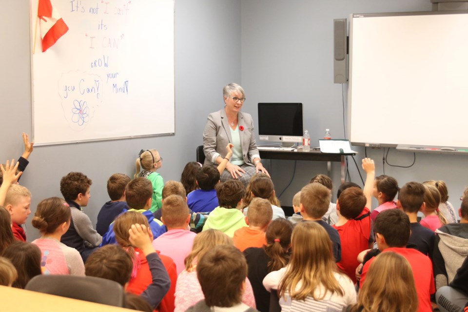 Minister of the Status of Women, Patty Hajdu, takes questions from grade four students at Holy Cross School on her role as minister and the inequality still experienced by women and girls around the world. 