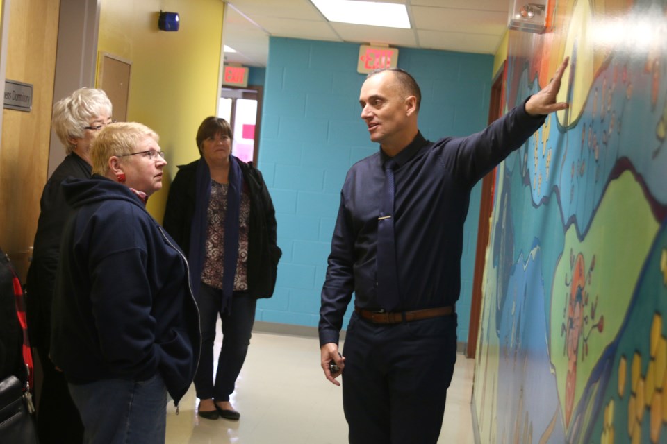 Thunder Bay Shelter House executive director, Gary Mack, shows off the Mural of Hope at the Shelter House during an open house on Monday. (Photos by Doug Diaczuk - tbnewswatch.com). 