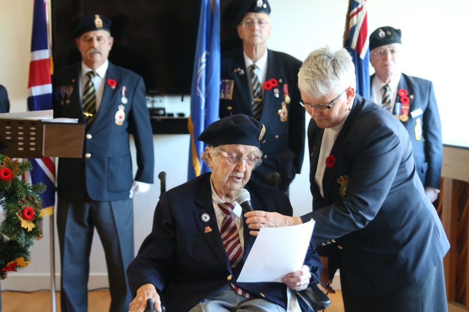 Ida Maxwell (left) reads In Flander's Fields with the help of Padre Nancy Ringham of Branch 5 Royal Canadian Legion during a Remembrance Day ceremony at the Sister Leila Greco Apartments on Nov. 8. 