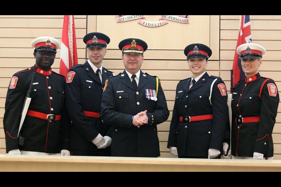 New Thunder Bay Police Service constables Paul Karpowich (second from left) and Amanda Zappitelli (second from right) were sworn in at a ceremony at the Thunder Bay Courthouse on Friday. (Matt Vis, tbnewswatch.com)