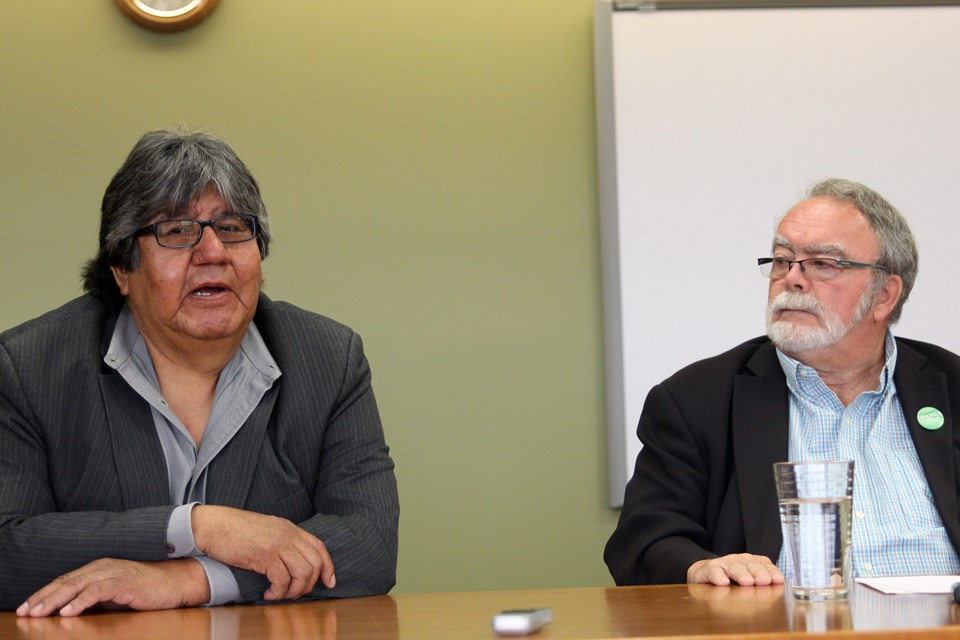Matawa First Nations Management CEO David Paul Achneepineskum (left) speaks while joined by Thunder Bay Coun. Iain Angus at a Tuesday morning media conference to announce details of a proposed letter of intent to grant the former Grandview Lodge to be converted into a high school with student accommodations. (Matt Vis, tbnewswatch.com)
