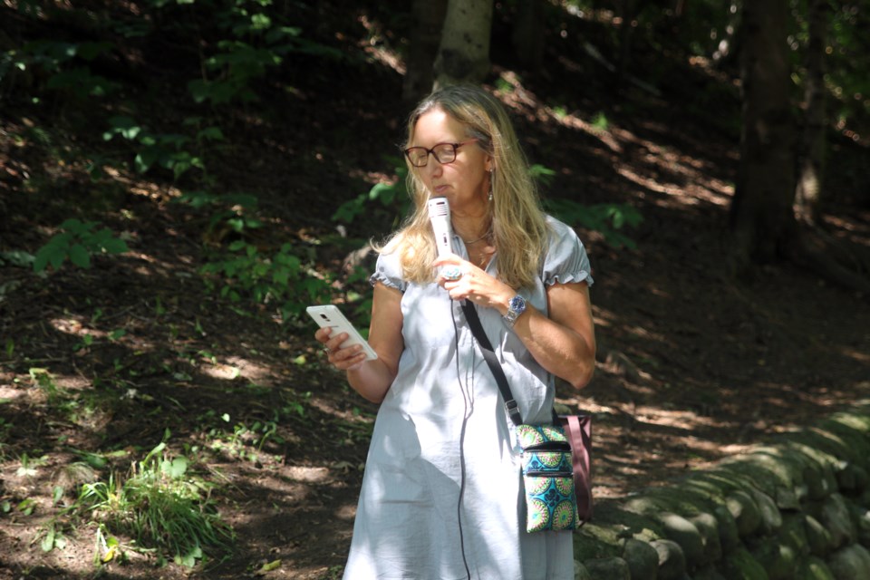 Taina Maki-Chaha, one of the organizers of the pop-up poetry event, shares her work during the stop at McVicar Creek. 