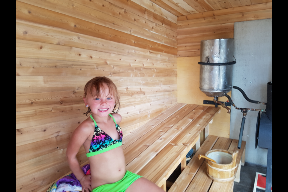 Suvi Wolfe enjoying the mobile sauna her dad built.