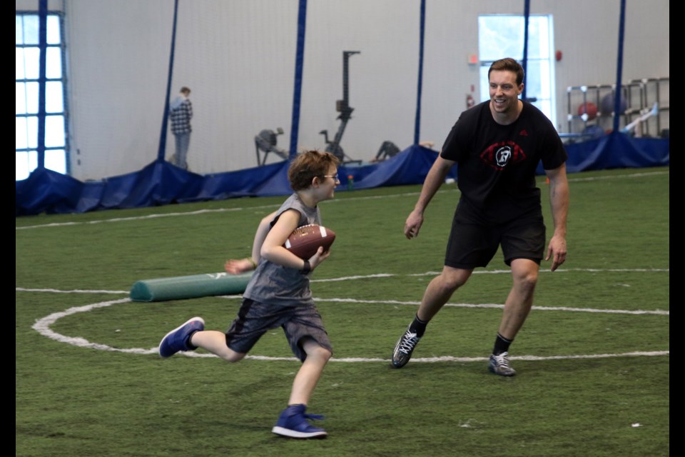 Aspiring football players took the field with Ottawa Redbacks defensive lineman, Nigel Romick during Training with a Pro: Football Edition on Saturday. (Photos by Doug Diaczuk - Tbnewswatch.com). 