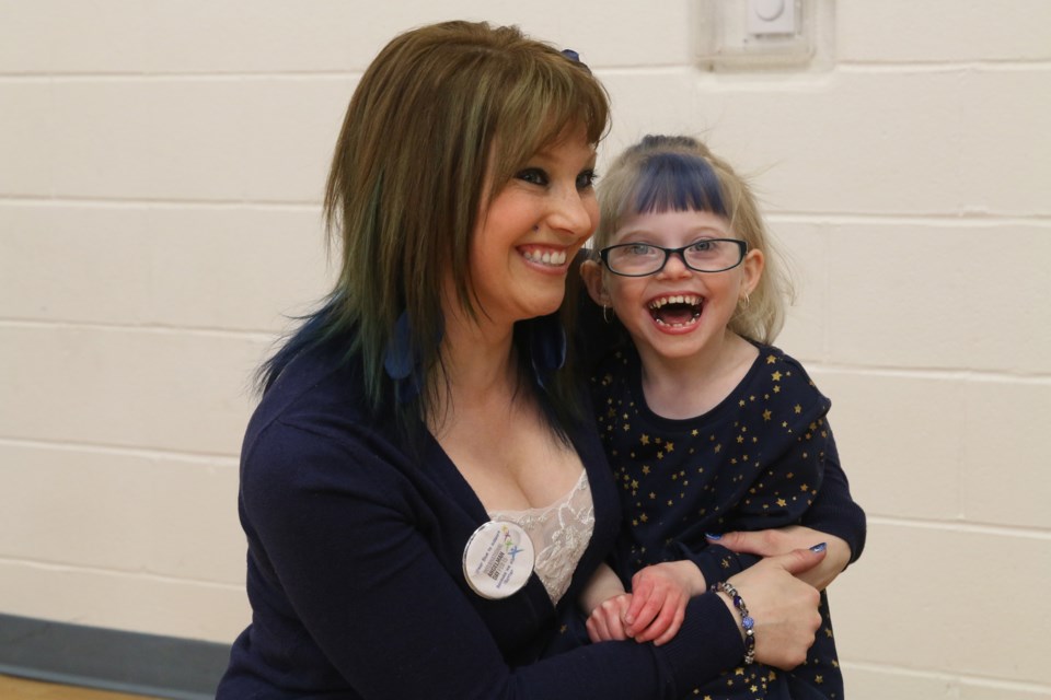 Amanda MacDonald and her daughter Zoey at Hyde Park school for a special assembly in support of Angelman's Syndrome Awareness Day. 