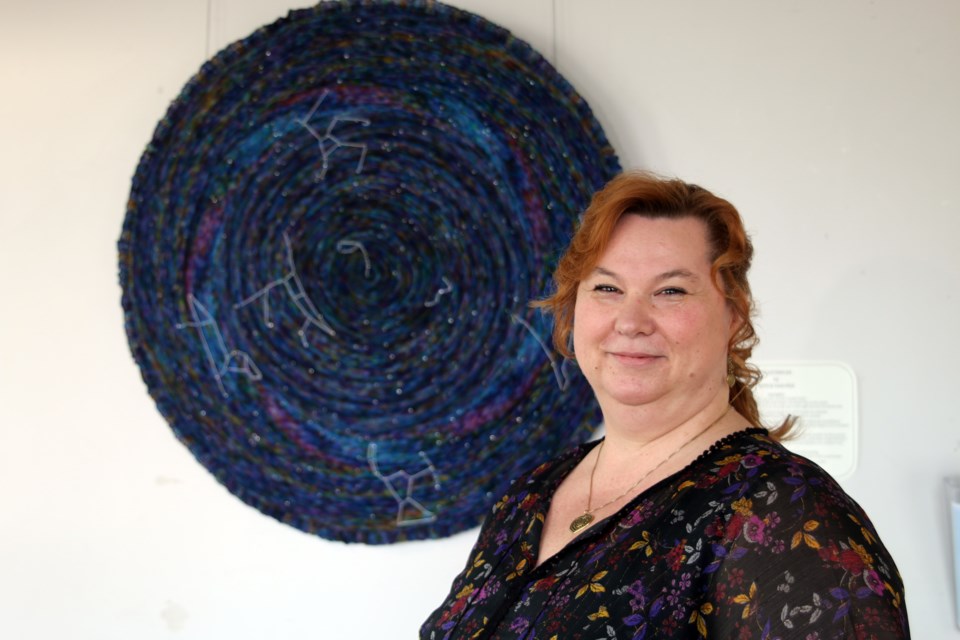 Heliina Swerdlyk and her feature piece, Celestarium, a recreation of the night sky on a circular shawl that includes all the constellations as viewed from the North Pole,