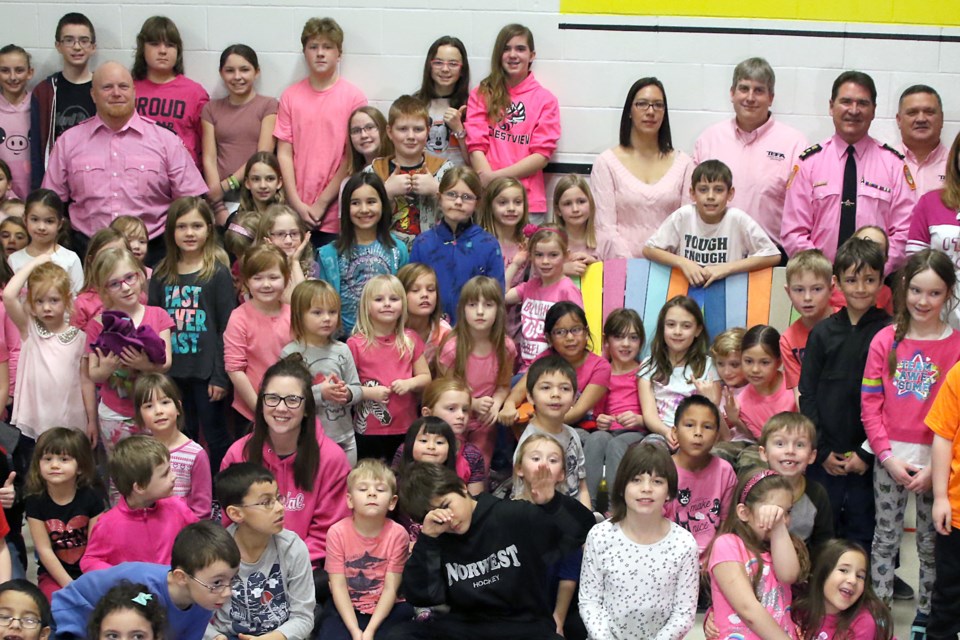 Members of the Thunder Bay Police Service join students and teachers at Crestview Public School on Wednesday, Feb. 22, 2017 for Pink Shirt Day festivities in support of anti-bullying causes (Leith Dunick, tbnewswatch.com). 