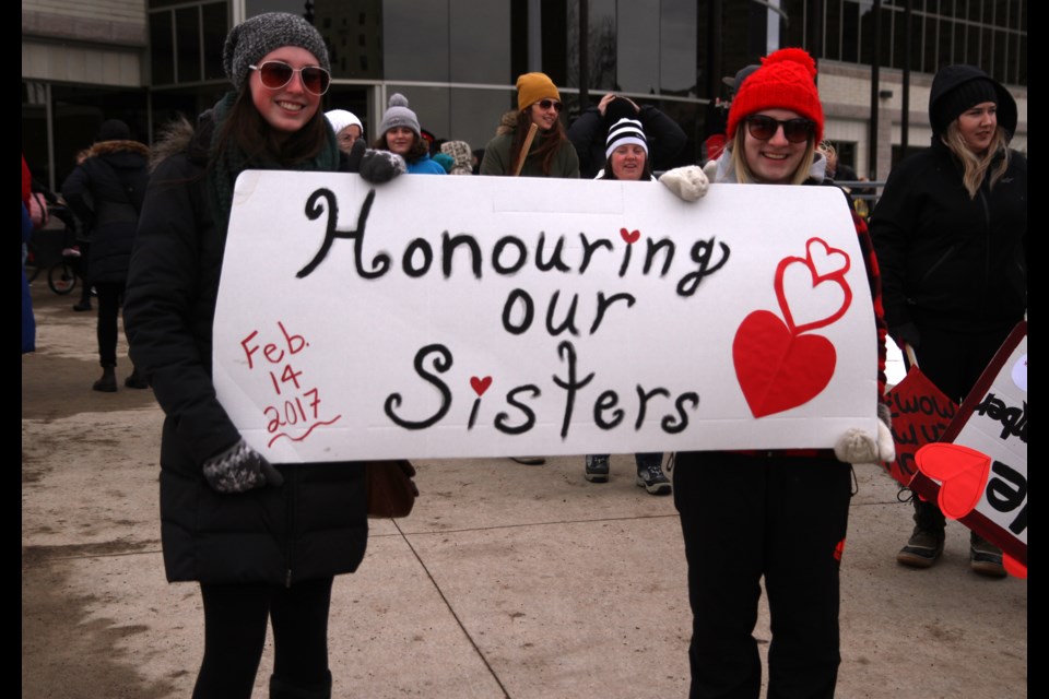 Tara Aikman (left) and Carrie Nagy lead the 9th annual Valentine's Day Memorial Walk Tuesday afternoon.