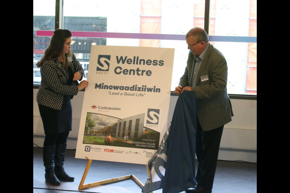 SUCCI President, Jodi Connor and Confederation College president, Jim Madder, unveil the name of the new wellness centre being constructed on the college campus. 