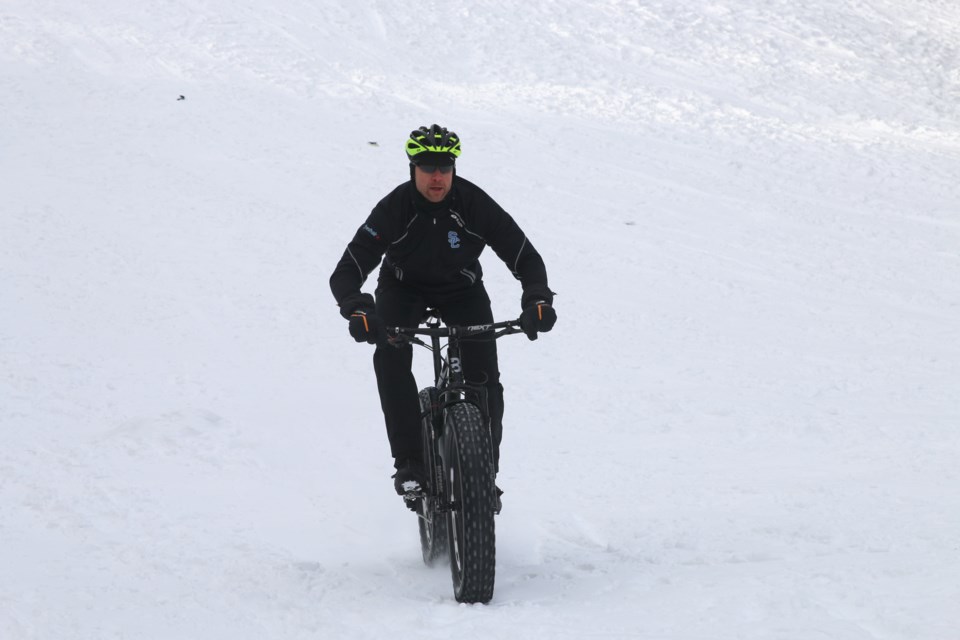 Keith Ailey races down the hill at Centennial Park on his fat bike. He will be joining Bauer and 7 other local riders at the Norpine Fat Bike Classic this weekend. 