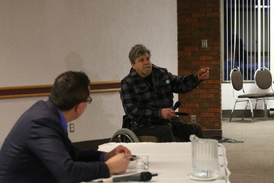 Maurice Rubenick shares his top infrastructure priorities with MP, Don Rusnak, during a public consultation Thursday evening. 