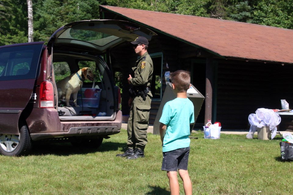 Andy Heerschap with Rex doing a demonstration of a search of a vehicle.