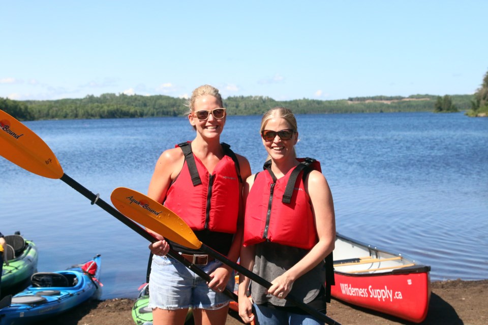 Andrea Santos and Erin Pearson after kayaking on Hazelwood Lake. 