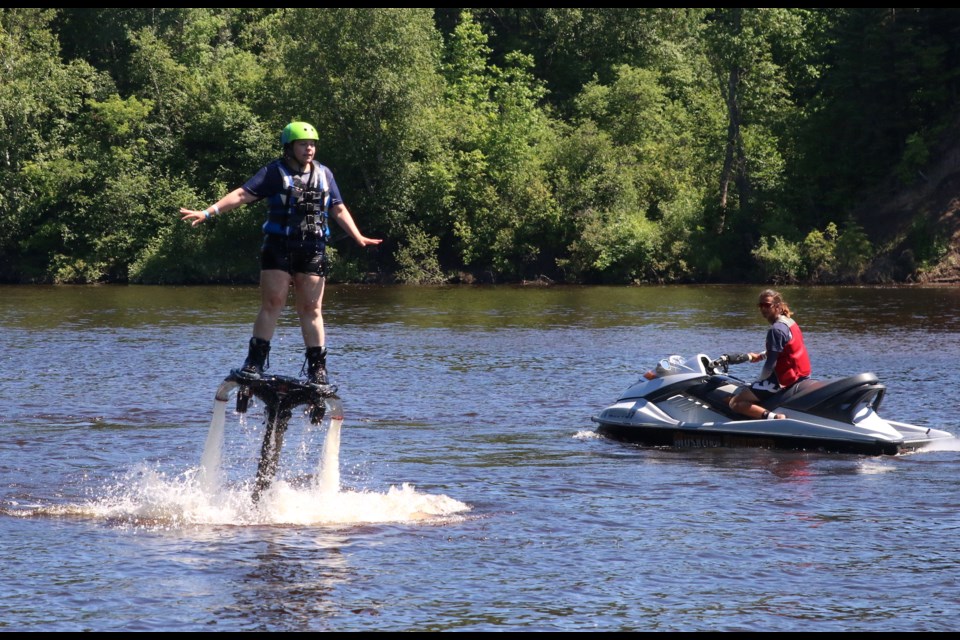 Kimberly Nelson tries fly boarding for the first time, breaking free from the water. Fly boarding lessons were offered throughout the weekend, one of the highlights of Karnival on the Kam that wrapped up on Sunday.  