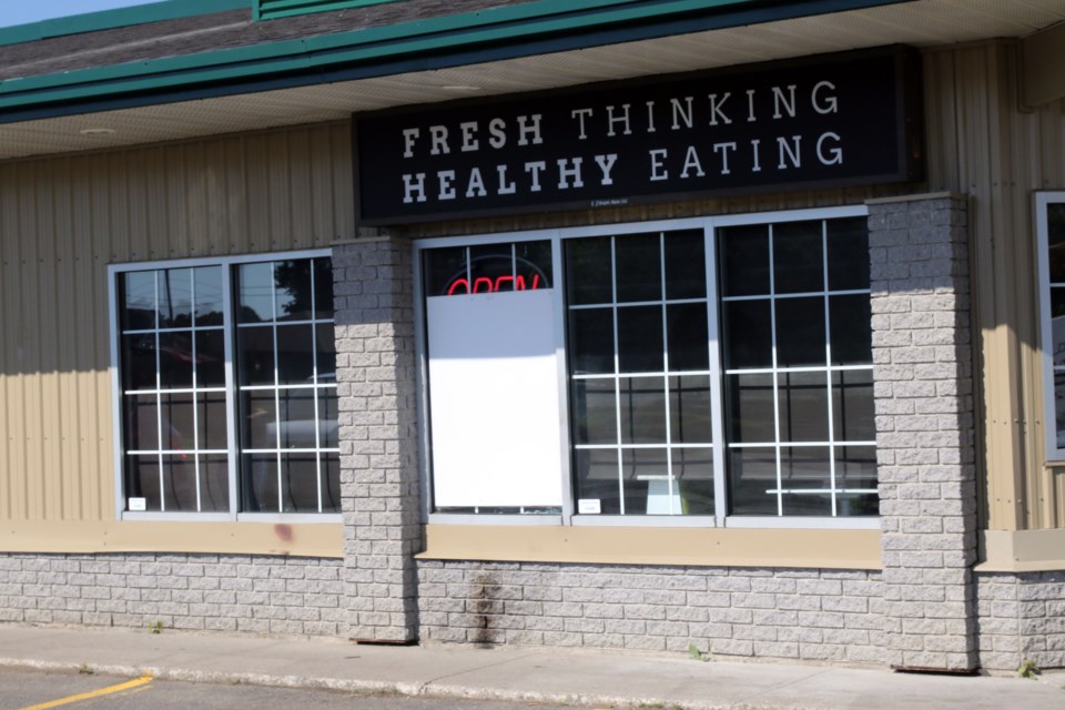 A beer bottle filled with gasoline was thrown at the window of the James Street Pita Pit early Tuesday (Michael Charlebois, tbnewswatch.com).