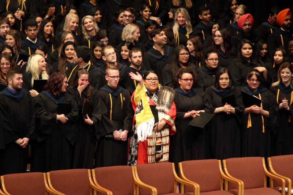 Nichole Barkman-Lands dressed in her Traditional Anishinaabe Regalia at convocation on Friday (Michael Charlebois, tbnewswatch.com).