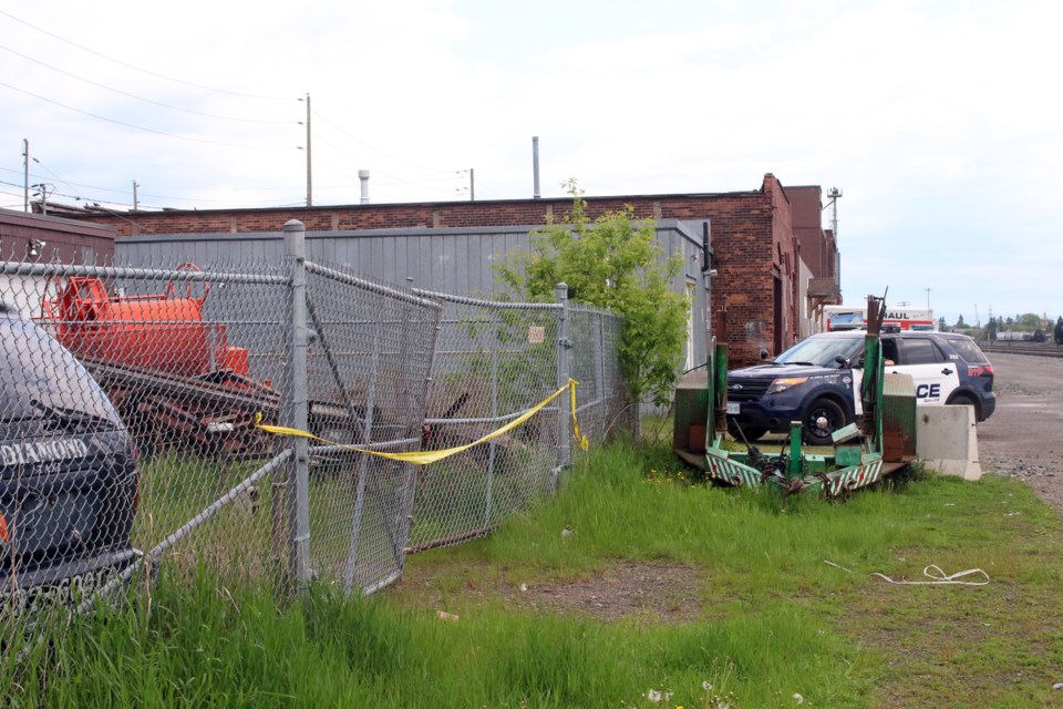 Police continue to hold the scene at a lot on the Hardisty Street, just north of Victoria Avenue East. 